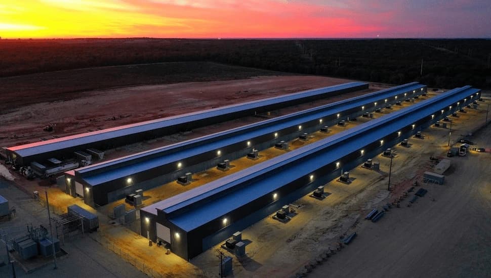 Aerial view of Whinestone Data Center facility, currently operating at 400 megawatts and undergoing upgrade to 750 megawatts.